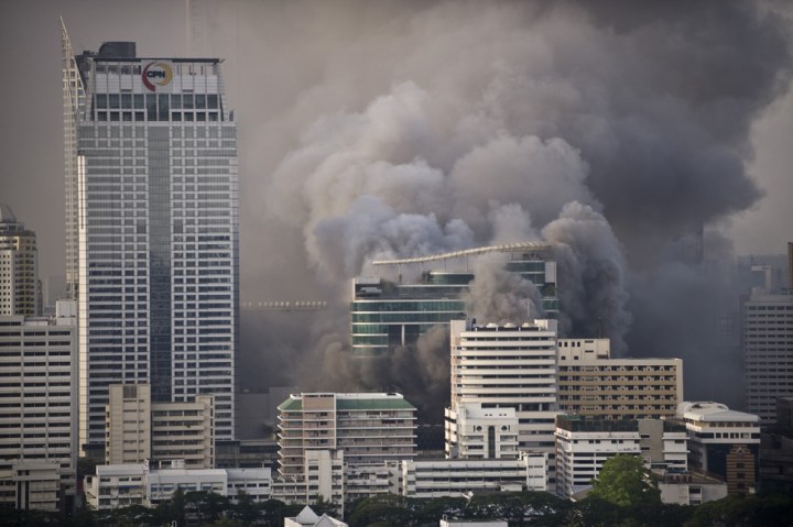 Smoke billows from a commercial area of