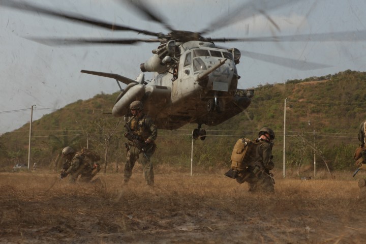 February 16, 2011, U.S. Marines with Maritime Raid Force (MRF), 31st Marine Expeditionary Unit (MEU), 3rd Marine Expeditionary Brigade (MEB), provide security as a U.S. Marine Corps CH-53E Super Stallion helicopter lands during a mock raid conducted with Royal Thai Marines in Hat Yao, Kingdom of Thailand, in support of Exercise Cobra Gold 2011. For three decades, Thailand has hosted Cobra Gold, one of the largest land-based, joint, combined military training exercises in the world. A successful Cobra Gold 2011 results in increased operational readiness of U.S. and Thai forces and matured military to military relations between the two countries. (U.S. Marine Corps photo by Lance Cpl Brennan O'Lowney/Released)